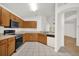 Well-lit kitchen with ample counter space and oak cabinets at 3390 Cypress Point Cir, St Cloud, FL 34772