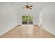 Open living room featuring tile floors and sliding glass doors to the screened lanai at 3390 Cypress Point Cir, St Cloud, FL 34772