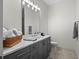 Modern bathroom featuring a vanity with a marble countertop, gray cabinets and good lighting at 340 Lakeview Rd, Winter Garden, FL 34787