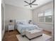 Cozy bedroom featuring wood floors, a ceiling fan, a soft rug, and a plush bed at 340 Lakeview Rd, Winter Garden, FL 34787