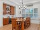 Cozy dining area featuring a wooden table, shuttered window, and built-in bar with ample storage at 340 Lakeview Rd, Winter Garden, FL 34787