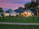 Beautiful home with a manicured lawn, lovely landscaping, and a dark roof at 340 Lakeview Rd, Winter Garden, FL 34787