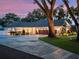 Charming home with a long driveway, three-car garage, and manicured landscaping at 340 Lakeview Rd, Winter Garden, FL 34787