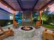 Relax in this outdoor space featuring a charming pergola and fire pit area at 340 Lakeview Rd, Winter Garden, FL 34787