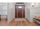 Elegant foyer featuring wood floors, paneled walls, and a stylish front door with glass inserts at 340 Lakeview Rd, Winter Garden, FL 34787