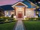 Inviting front entrance with a beautiful wooden door and manicured landscaping at 340 Lakeview Rd, Winter Garden, FL 34787