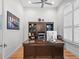 Well-lit home office with custom built-ins, a large desk, and plantation shutters at 340 Lakeview Rd, Winter Garden, FL 34787