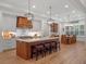 Gourmet kitchen with a large island, seating, custom cabinets, and stainless steel appliances at 340 Lakeview Rd, Winter Garden, FL 34787