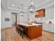 Bright and airy kitchen with a large island, bar stools, custom cabinetry, and pendant lighting at 340 Lakeview Rd, Winter Garden, FL 34787