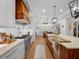 Gourmet kitchen boasts stainless steel appliances, a large island, and custom cabinetry at 340 Lakeview Rd, Winter Garden, FL 34787