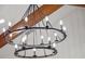 Statement circular light fixture with candelabra bulbs and wooden beam accent at 340 Lakeview Rd, Winter Garden, FL 34787