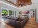 Spacious living room with a wood-paneled ceiling, recessed lights, and a pool view at 340 Lakeview Rd, Winter Garden, FL 34787