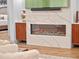 Cozy living room features a modern fireplace, custom cabinetry, and a large television at 340 Lakeview Rd, Winter Garden, FL 34787