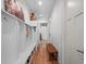 A mud room features coat hooks and storage, bench seating and wood floors at 340 Lakeview Rd, Winter Garden, FL 34787