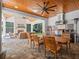 This outdoor living space features a wood ceiling, fireplace, sitting area and outdoor kitchen at 340 Lakeview Rd, Winter Garden, FL 34787