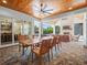 This outdoor living space features a wood ceiling, fireplace, sitting area and dining area at 340 Lakeview Rd, Winter Garden, FL 34787