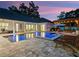 A luxurious pool and spa area with an outdoor lounge, perfect for entertaining at 340 Lakeview Rd, Winter Garden, FL 34787