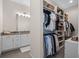 This walk-in closet features built in storage, multiple shelves, and a view of the bathroom at 340 Lakeview Rd, Winter Garden, FL 34787