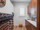 Charming butler's pantry with sink, wine racks, and cabinetry for storage at 340 Lakeview Rd, Winter Garden, FL 34787