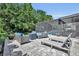 Outdoor patio featuring multiple seating areas and outdoor loungers with lush backyard at 384 Old Alemany Pl, Oviedo, FL 32765