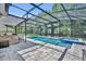 The backyard has a screened lanai, pool and spa, bar, and patio seating at 384 Old Alemany Pl, Oviedo, FL 32765