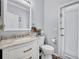 Bathroom with white vanity, marble countertop and updated fixtures at 384 Old Alemany Pl, Oviedo, FL 32765