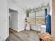 Bedroom featuring an open door, window, and vines hanging on the wall at 384 Old Alemany Pl, Oviedo, FL 32765