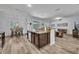 Open concept kitchen with granite countertops and stainless appliances that opens to dining at 384 Old Alemany Pl, Oviedo, FL 32765