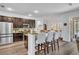 Eat-in kitchen features granite countertops, stainless appliances, and an island at 384 Old Alemany Pl, Oviedo, FL 32765