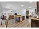 Open floor plan featuring kitchen with island overlooking living room at 384 Old Alemany Pl, Oviedo, FL 32765
