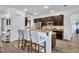 Kitchen features granite countertops, stainless appliances, and seating at island at 384 Old Alemany Pl, Oviedo, FL 32765
