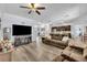Open concept living room with luxury vinyl plank flooring that opens to the kitchen at 384 Old Alemany Pl, Oviedo, FL 32765