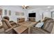 Spacious living room features luxury vinyl plank flooring and comfortable seating at 384 Old Alemany Pl, Oviedo, FL 32765