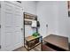 Mudroom with built-in bench, storage baskets, and coat rack at 384 Old Alemany Pl, Oviedo, FL 32765