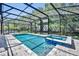 Screened pool with spa featuring brick pavers, and access to outdoor living, grilling, and dining areas at 384 Old Alemany Pl, Oviedo, FL 32765