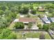 Spacious single-Gathering home features a large backyard with a playground, privacy fence, and mature trees at 40533 E 8Th Ave, Umatilla, FL 32784