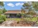 Charming home with a spacious backyard, screened-in porch, and mature trees, perfect for outdoor living at 40533 E 8Th Ave, Umatilla, FL 32784