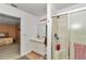 Spacious bathroom with neutral color scheme, featuring a vanity and glass enclosed shower at 40533 E 8Th Ave, Umatilla, FL 32784