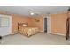 Bedroom featuring carpeted floors, a ceiling fan, and a door to the outside at 40533 E 8Th Ave, Umatilla, FL 32784