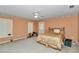 Large bedroom featuring carpeted floors, a ceiling fan, and a door to the outside at 40533 E 8Th Ave, Umatilla, FL 32784