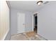 An empty bedroom with a door leading to the outside and a second entry to a bathroom at 40533 E 8Th Ave, Umatilla, FL 32784