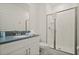 Well-lit bathroom featuring a modern vanity, framed mirror, and enclosed shower at 4363 Scene Ln, Kissimmee, FL 34746