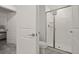 Bathroom featuring a glass shower, toilet, and open door at 4363 Scene Ln, Kissimmee, FL 34746