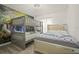Bedroom featuring bunk beds and a queen bed, with white linens and pillows at 4363 Scene Ln, Kissimmee, FL 34746