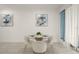 Bright dining area with a glass table, white chairs, and ample natural light at 4363 Scene Ln, Kissimmee, FL 34746