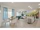 Open floor plan featuring modern decor, dining area, living room, and adjacent waterfall wall decor at 4363 Scene Ln, Kissimmee, FL 34746