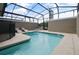 Screened-in pool area with lounge chairs at 4363 Scene Ln, Kissimmee, FL 34746