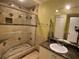 The bathroom features a sleek glass shower, granite countertop, and great vanity lighting at 4756 Walden Cir # 21, Orlando, FL 32811