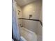 Combination bath/shower with tiled walls and shower curtain at 4756 Walden Cir # 21, Orlando, FL 32811