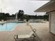 Relaxing community pool with a fountain overlooking the peaceful pond at 4756 Walden Cir # 21, Orlando, FL 32811